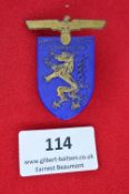 A German District Day Badge, pressed blue plastic issue bearing gilt eagle and district crest of
