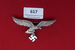 Luftwaffe Eagle Cap Badge – A Luftwaffe eagle cap badge in metal, finely detailed with