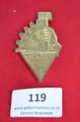 A German NSBO (National Socialist Factory Cell Organisation) badge, gilt-coloured alloy issue,