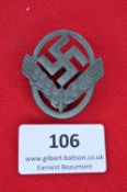 A Third Reich-era Reichsarbeitsdienst (RAD) cap badge, cast in zinc alloy, displaying a prominent