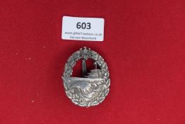 Kriegsmarine Destroyer Badge – A heavy silvered oval badge featuring a warship cutting through