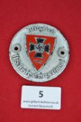 A German WWII NS Reichskriegerbund (veterans’ association) enamel membership plaque, circular cast