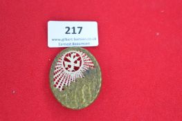 German Faith & Beauty Organisation Badge – oval brass frame enclosing textile insert with sunburst