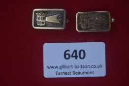 Pair of rectangular gilt metal badges with clip fasteners, each featuring a shield with crown and