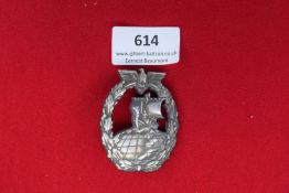 Kriegsmarine Auxiliary Cruiser Badge – A Kriegsmarine Auxiliary Cruiser Badge in tombak, oval,