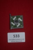 WHW miniature flag badge in the form of a Regiment General Göring standard, enamelled in green and
