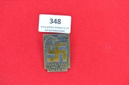 Pressed Metal NSDAP Gautag Wien Badge – A rectangular gilt-coloured pressed metal badge with large