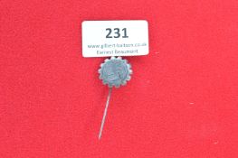 Grey alloy stickpin badge in the form of a cogwheel with central swastika emblem in relief,