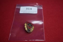 Enamelled Membership Badge – A small red enamel shield bearing a black swastika within cross, over