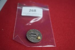 A German WWII-era membership badge, zinc construction. Reverse marked 