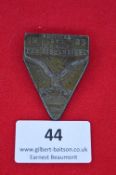 A German NSDAP district rally badge, triangular bronze issue with eagle over swastika and oak