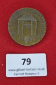 A German Third Reich Commemorative Badge, bronze-finish circular issue inscribed “Die Deutsche
