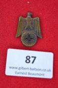 A German Third Reich WHW Donation Badge, bronze issue in the form of a Party eagle above roundel