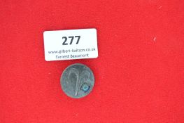 A German WWII-era membership badge, zinc construction. Reverse marked 