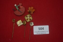 Mixed lot of badges including various stickpins (gilt and base metal) and carved/coloured plastic