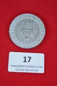 A German tinnie for the Reichsbahn celebrations at Neumünster, die-struck aluminium badge with