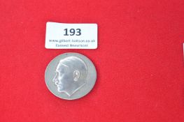 German Third Reich era commemorative medallion, silvered metal, one side with profile portrait of