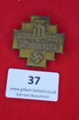 A German gymnastics festival badge, cross-form bronze issue inscribed “Landes Turnfest Minden