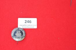 Commemorative Tinnie Badge “Freiheit und Brot – 29 März 1936” – A circular silvered metal badge with