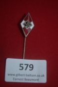 Diamond-shaped enamel Hitlerjugend stickpin with red/white/black swastika design. Mounted on