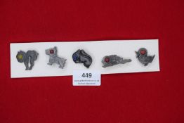 A German WWII WHW set of miniature pressed-metal animal badges with coloured centres, including cat,