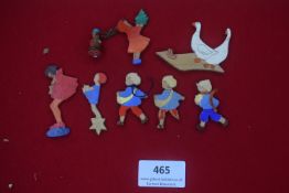 Eight German WWII painted wooden badges — Cut-out figures including children, Christmas-themed