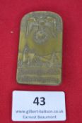 A German district rally badge, rectangular bronze issue with rounded top, embossed with eagle and