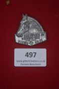 A German WWII WHW cast metal day badge, in the form of a horse’s head, inscribed “Das Pferd im
