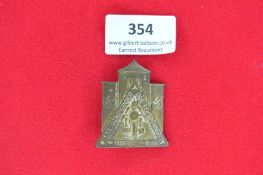 NSKK Warendorger Dreiecksrennen Badge – A triangular motorcycle racing commemorative badge featuring