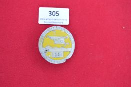 Circular Aluminium Badge “Fliegerhorst Kommandantur Ludwigslust” – A circular aluminium badge