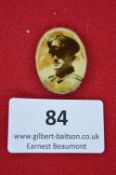 A German Third Reich memorial badge, oval portrait brooch with sepia photograph of a uniformed