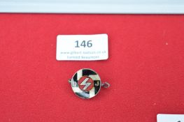 Deutsches Jungvolk (DJ) membership badge, circular design with red enamel centre bearing a silver