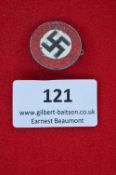 A German Third Reich NSDAP Party Badge, circular enameled issue with black swastika to white
