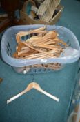 Laundry Basket Containing Wooden Coat Hangers