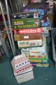 Collection of Jigsaw Puzzles and a Biscuit Barrell