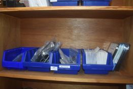 *Four plastic storage boxes containing assorted pr
