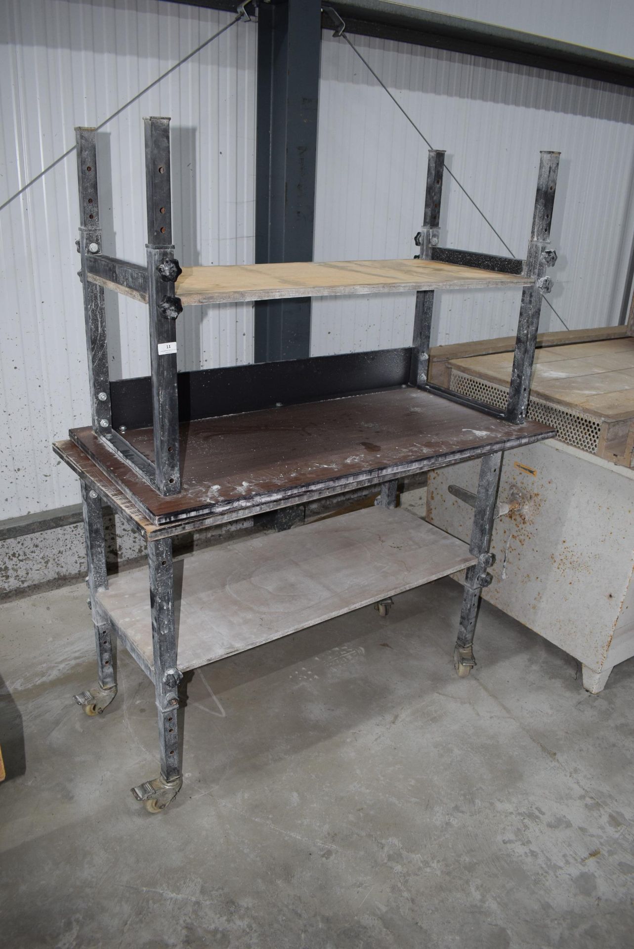 *Pair of adjustable height work benches 60cm by 12