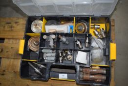 *Storage compartment containing various tile cutti