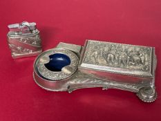 Smoking paraphernalia which includes a lighter and cigarette dispenser with ashtray