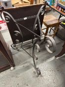 Vintage wrought iron table base with a decorative scroll design