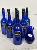 6 x Blue Harveys Bristol Cream Bottoes and a Blue Glass Vase