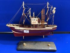 Model of a red fishing trawler (A/F)