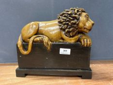 Resin resting Lion on podium ornament