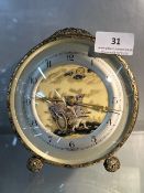 Oriental scene mantle clock with filigree border