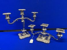 A pair of matching silver plated candelabras