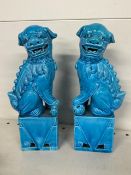 Pair of turquoise glazed porcelain foo dogs (one has been repaired)