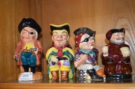 Four small Toby Jugs by Doulton and Wade etc