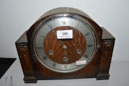 1950's oak cased mantel clock with carved decorati