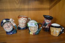 Five small character jugs including Royal Doulton