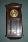 1930’s Oak Cased Wall Clock with Brass Face